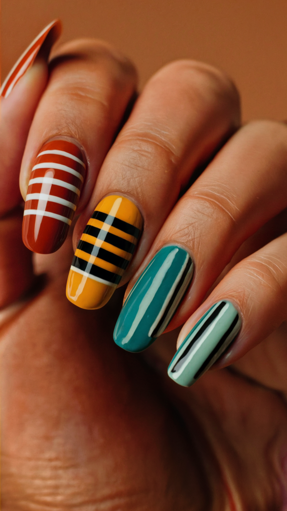 Image of nails featuring bold horizontal stripes in retro colors such as burnt orange, mustard yellow, and teal. The stripes vary in thickness and are perfectly aligned across each nail, evoking a vintage streetwear aesthetic. The vibrant color palette and clean lines capture the essence of 70s and 80s fashion, bringing a nostalgic yet modern twist to nail art. The design is simple yet impactful, making it a perfect representation of retro street style with a contemporary edge.