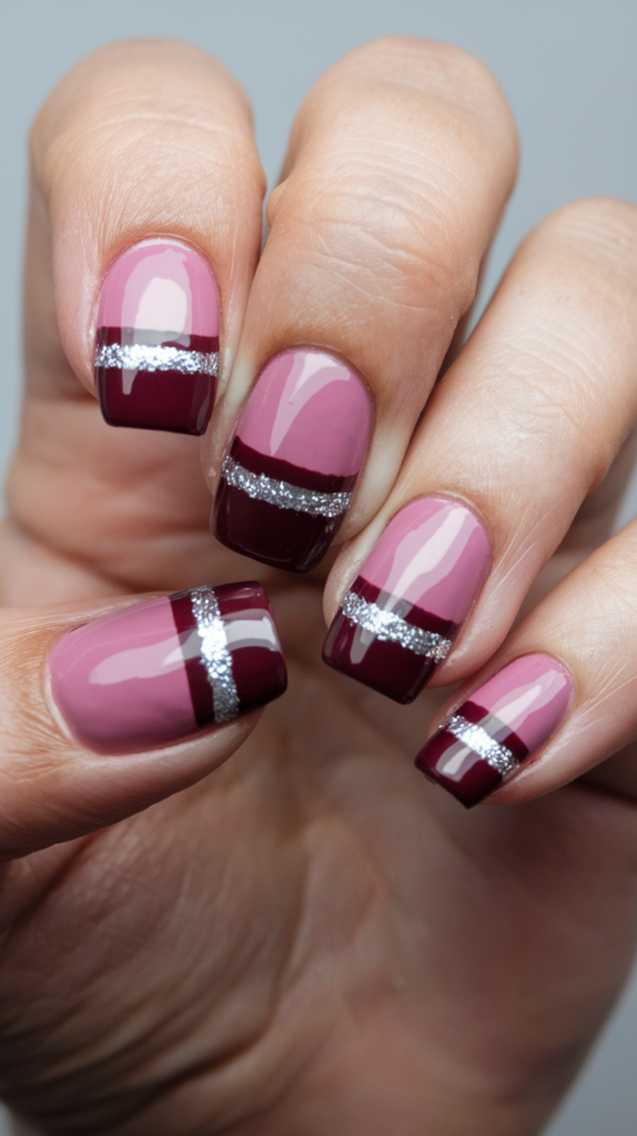 Nude nails with a single gold glitter stripe down the center of each nail.
