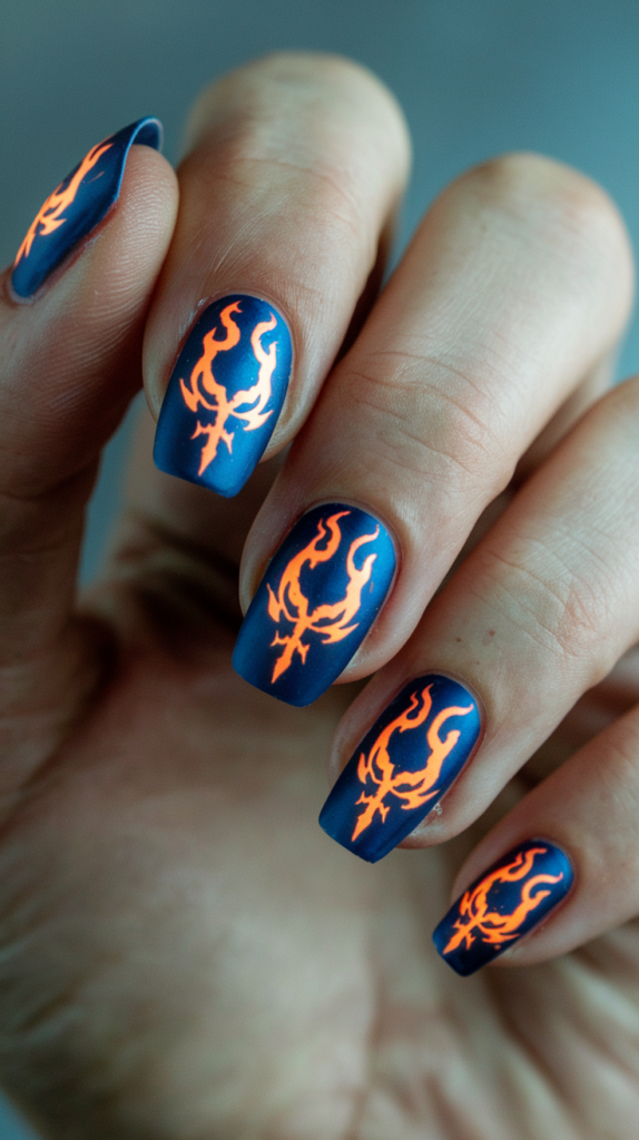 Blue-toned nails featuring demonic flames and the True Cross Academy insignia with a glowing effect