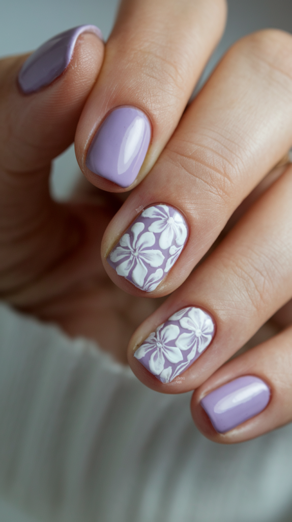 Glossy grape purple nails paired with a matte lilac accent nail for a chic contrast