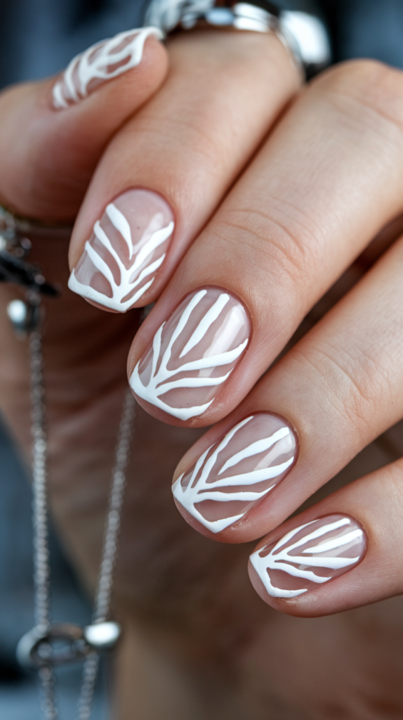 White nails with alternating transparent and white stripes for a minimalist look.
