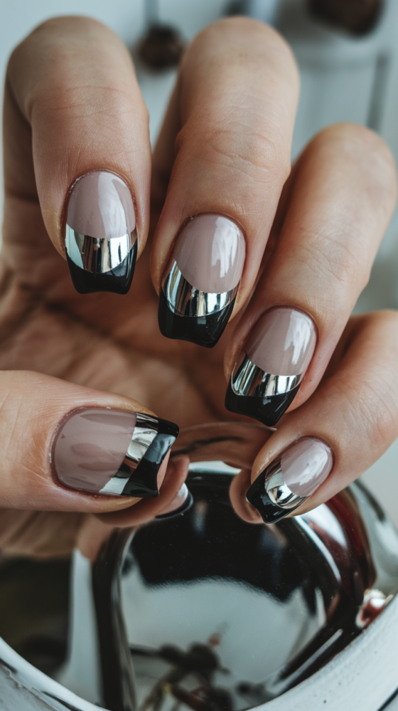 Futuristic black nails with shiny chrome tips, reflecting light for a mirror-like finish