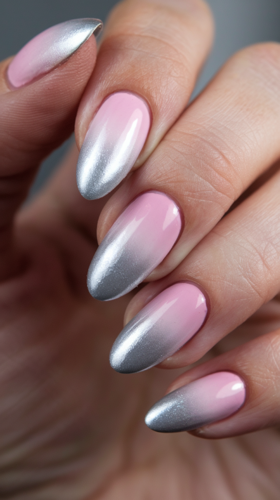 A seamless gradient design transitioning from pink to shimmering silver, creating a metallic ombré effect