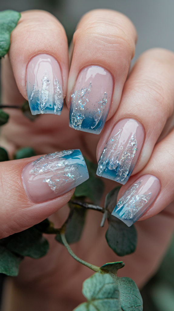 Nails with glittering frozen icicles hanging from the tips, creating a frosty and elegant holiday look