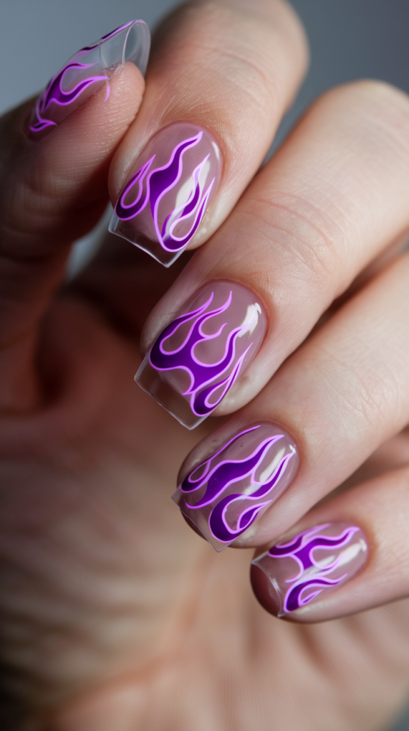 Clear or nude base nails with vivid neon purple flame designs extending from the tips.
