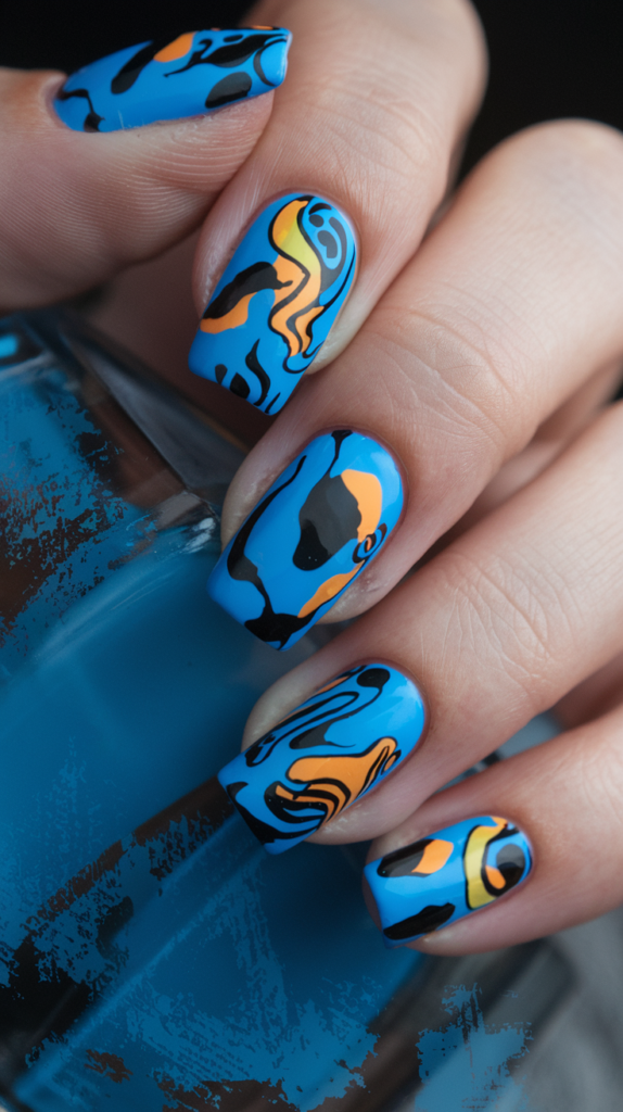 Nails with abstract blue patterns in various shades, featuring swirls, lines, and shapes for a creative, modern look