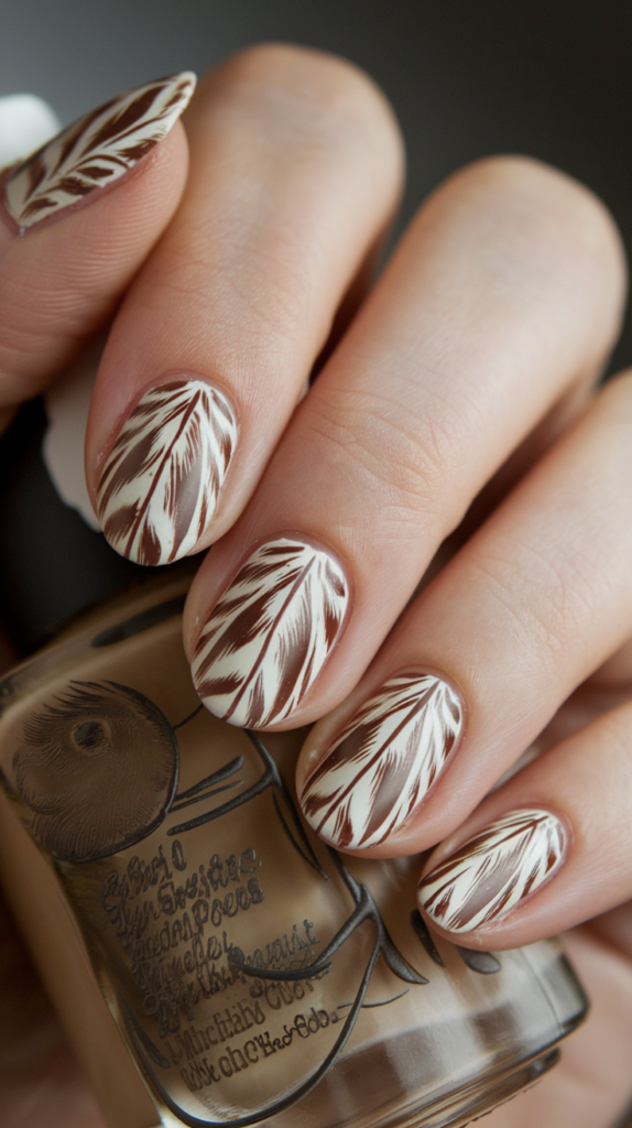 Intricate owl feather nail art in earthy tones, featuring textured feather details and soft shading