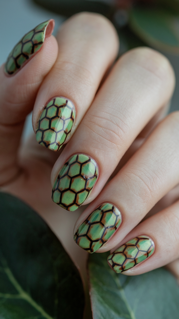 Earthy green and brown tortoiseshell nail design with a natural, hexagonal pattern