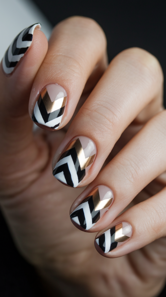 risp chevron patterns in black, white, and gold arranged sharply on a glossy nude base.