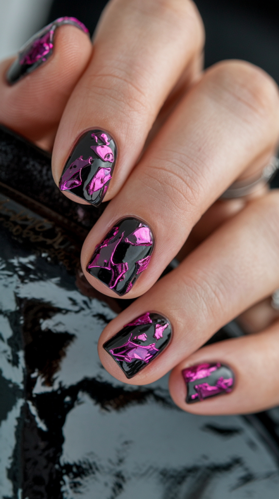 Purple Foil Accent Nails – Deep purple nails with abstract purple foil fragments layered over black, giving a textured and artistic look