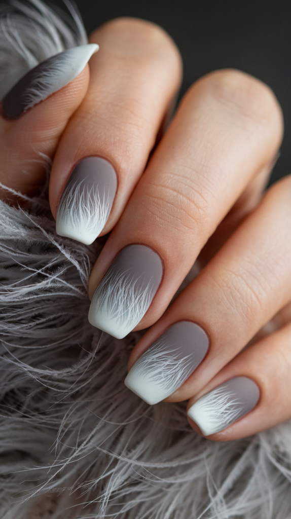 Gray-to-white ombre nails with subtle, feathery strokes resembling the texture of wolf fur