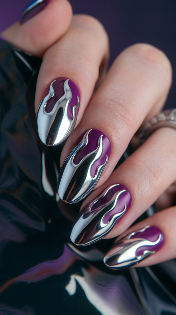 Edgy chrome flame designs over matte black nails, reflecting light dramatically