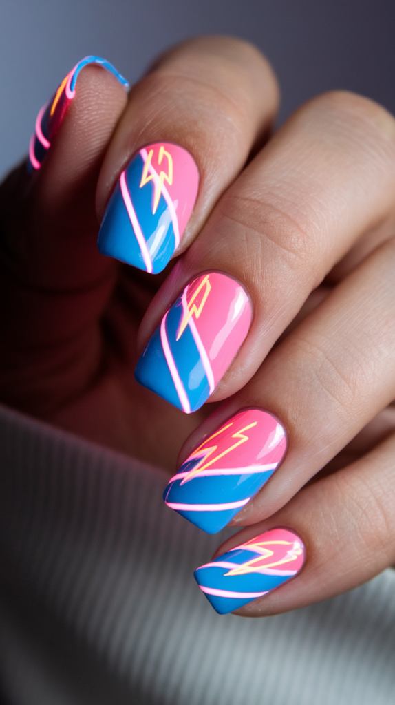 Diagonal neon stripes in blue and pink with lightning bolt designs on nails