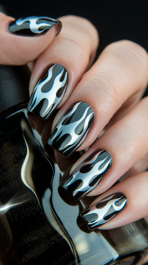 Shiny chrome nails adorned with rhinestones for added sparkle and glamour.

