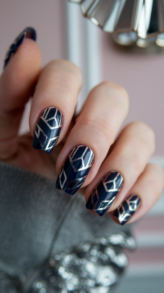 sapphire nails with silver metallic geometric shapes, offering a bold and regal Art Deco-inspired manicure.
