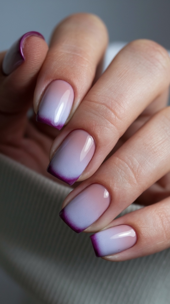 Gradient French Tips – Nails with a soft gradient French tip, starting from light lilac at the base and blending into deeper purple toward the tips