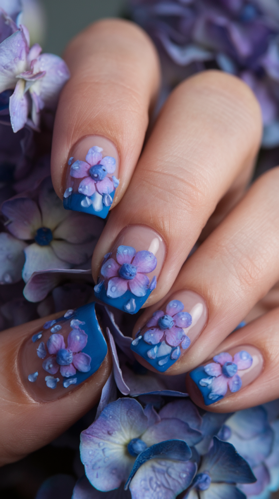 Rainy Season Hydrangea Nails: Soft blue and purple hydrangeas with glossy raindrop accents on a pastel base.