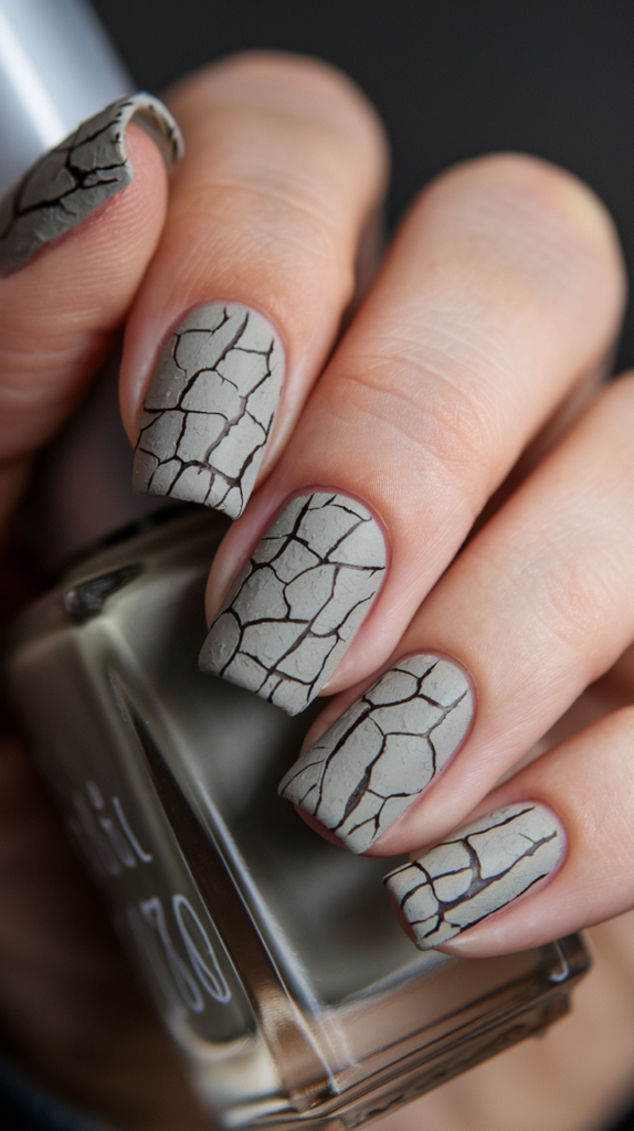 Gray nails with a cracked, textured finish to mimic the rugged look of elephant skin