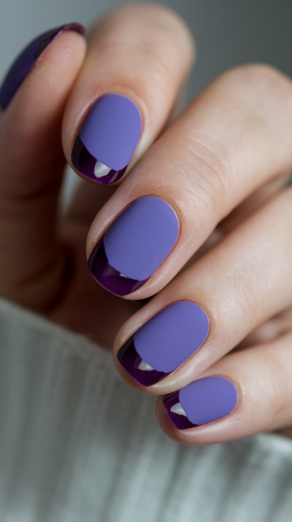 A matte violet base with glossy tips, creating a subtle contrast between textures for a sophisticated finish.