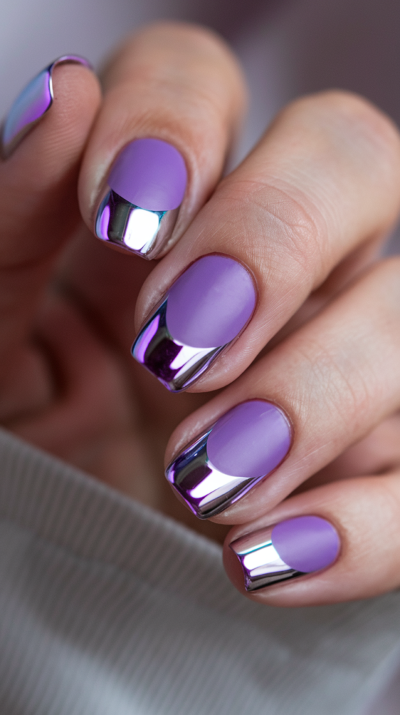 Deep violet nails with metallic chrome tips, providing a high-shine, glamorous look.

