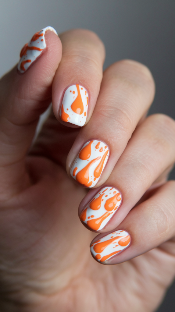 Playful orange paint splatter design over a white base for an artsy feel.
