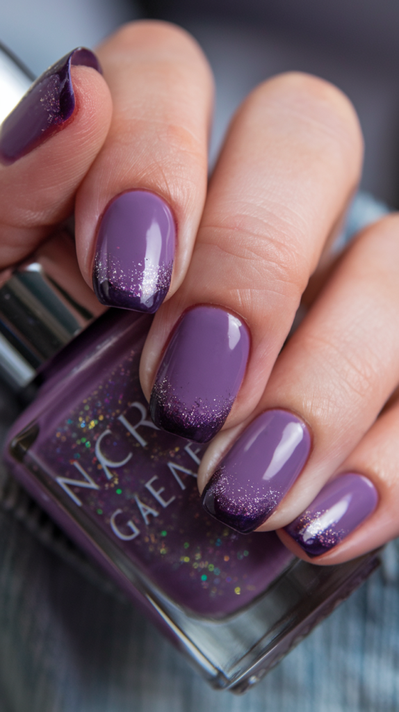 Deep plum to vibrant violet gradient nails with a bold glossy finish.